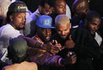 Chris Brown, right, poses for a selfie with guests at the 2014 BMI R&B Hip Hop Awards at the Pantages Theatre on Friday, Aug. 22, 2014, in Los Angeles.