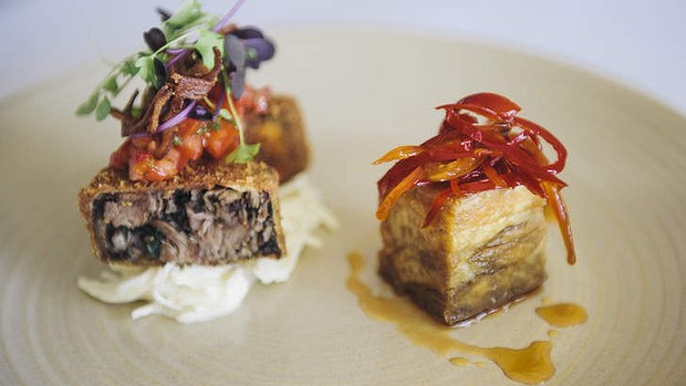 Pork assiette includes belly with chilli lime caramel, rolled shin and boudin noir, crispy ear and herb salad.