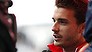 Marussia Formula One driver Jules Bianchi of France speaks to the media after a news conference at the Suzuka circuit in this October 2, 2014 file photo. Critically injured French Formula One driver Jules Bianchi is no longer in an artificial coma but remains unconscious, his family said in a statement on November 19, 2014. Bianchi, who suffered the most serious F1 race injury since Ayrton Senna died in 1994 when he crashed into a recovery tractor in the wet at the Japanese Grand Prix on Oct. 5, has been transferred from Yokkaichi to a hospital in Nice. REUTERS/Yuya Shino/Files (JAPAN - Tags: SPORT MOTORSPORT F1)