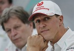 FILE - In this Thursday, Oct. 4, 2012 file photo, former Mercedes F1 driver Michael Schumacher of Germany pauses during a news conference to announce his retirement from Formula One at the end of 2012 in Suzuka, Japan. Former Formula One world champion Michael Schumacher has left hospital to continue his recovery at home, his manager said Tuesday. The seven-time champion suffered a serious head injury while skiing in France in December, resulting in him being put in a coma.