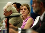 File - Katherine Gun, center, former translator in GCHQ, the British equivalent of the National Security Agency, who was put on trial for releasing NSA memo seeking British assistance in bugging offices and homes of UN Security Council members prior to vote on Iraq; veteran CIA analyst David MacMichael, left, and 27-year-old veteran of the CIA Ray McGovern, right, listen to speakers, during a forum attended by whistleblowers at American University, Wednesday, Sept. 8, 2004, in Washington.