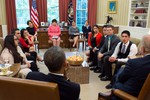 File - President Barack Obama and Vice President Joe Biden meet with DREAMers who have received Deferred Action and U.S. citizen family members of undocumented immigrants, in the Oval Office, May 21, 2013.