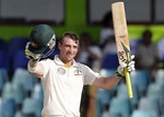 In this Sept. 19, 2011 file photo Australia's batsman Phillip Hughes celebrates after scoring a century during the fourth days' play of the third cricket test match between Australia and Sri Lanka in Colombo, Sri Lanka.