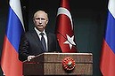 Russia's President Vladimir Putin is pictured during a joint news conference with his Turkish counterpart Tayyip Erdogan (not pictured) in Ankara December 1, 2014. Putin said on Monday that Moscow could not carry on with the South Stream project if the European Union was opposed to it. Speaking at a joint news conference with Turkish President Erdogan, Putin said the European Commission was reluctant to give the green light to the South Stream project.  REUTERS/Mikhail Klimentyev/RIA Novosti/Kremlin (TURKEY - Tags: POLITICS) ATTENTION EDITORS - THIS IMAGE HAS BEEN SUPPLIED BY A THIRD PARTY. IT IS DISTRIBUTED, EXACTLY AS RECEIVED BY REUTERS, AS A SERVICE TO CLIENTS