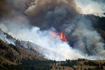 File - The Washington National Guard continues to provide support to the people of North Central Washington who have been affected by the Carlton Complex Fire, 21 July, 2014.