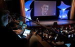 Former NSA contractor Edward Snowden participates in a conversation via video with John Perry Barlow, co-founder & vice chairman of the Electronic Frontier Foundation, at the 2014 Personal Democracy Forum, at New York University, Thursday, June 5, 2014 in New York.