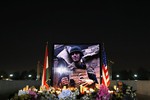 A photograph of James Foley, the freelance journalist killed by the IS group, is seen during a memorial service in Irbil, 350 kilometers (220 miles) north of Baghdad, Iraq, Sunday, August 24, 2014. Foley, the U.S. journalist slain by Islamic State militants after being held in captivity for nearly two years, was remembered in a small ceremony in Irbil on Sunday.