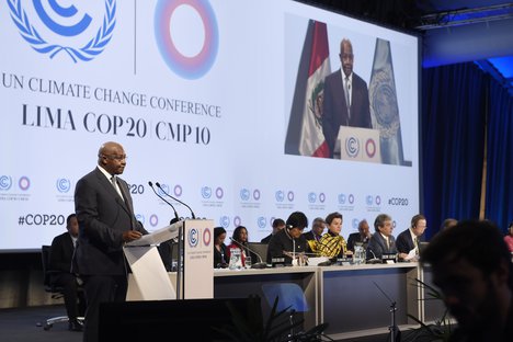 Sam Kutesa (at lectern), President of the sixty-ninth session of the General Assembly, addresses the UN Climate Change Conference taking place in Lima, Peru, 9 December, 2014.