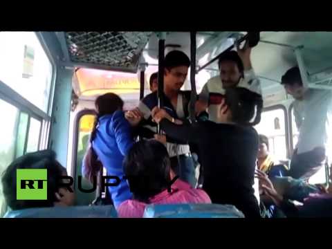 Two college girls beat molesters with belts on Indian bus