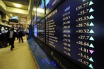 NYSE Euronext market indicators are shown on a board on the floor of the New York Stock Exchange Monday, Oct. 12, 2009 in New York