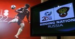 A photo of Russian soccer star Andrei Arshavin, of Arsenal, is seen as part of the display during the official presentation of Russia's bid to host the soccer World Cup championships, during the unveiling of the bid in Moscow, Russia, Friday, Oct. 9, 2009.