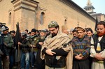 Chairman of All Parties Hurriyat Conference Mirwaiz Umar Farooq offers special prayers in Srinagar, India, for the victims killed in a Taliban attack in Peshawar, Pakistan, Wednesday, Dec. 17, 2014.