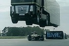 Lotus's race truck leaps over its Formula 1 car.