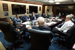 File - President Barack Obama, with Vice President Joe Biden, convenes a National Security Council meeting on Cuba in the Situation Room of the White House, Nov. 6, 2014.