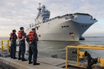 NORFOLK (Jan. 26, 2012) Sailors form the amphibious assault ship USS Kearsarge (LHD 3) stand by as the French navy amphibious assault ship FS Mistral (L9013) approaches Naval Station Norfolk. Kearsarge is sponsoring Mistral during their visit to the United States