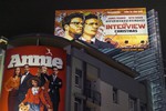 FILE - In this Wednesday, Dec. 17, 2014 file photo, a banner for "The Interview" is posted outside Arclight Cinemas in the Hollywood section of Los Angeles. Sony Corp.’s miseries with its television and smartphone businesses were bad enough.