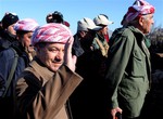 Kurdistan Iraqi regional government President Massoud Barzani arrives to support Kurdish forces as they head to battle Islamic State militants, on the summit of Mount Sinjar, in the town of Sinjar, Iraq, Sunday, Dec. 21, 2014.