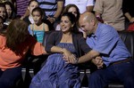 Gerardo Hernandez, right, member of "The Cuban Five," touches the belly of his pregnant wife Adriana Perez