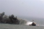 In this image provided by the Italian Navy, smoke billows from the Italian-flagged Norman Atlantic after it caught fire in the Adriatic Sea, Sunday, Dec. 28, 2014.