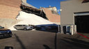 Wall at salt warehouse collapses, leaving cars buried in mountain of white