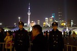 Chinese paramilitary policemen are deployed in the aftermath of a deadly stampede in Shanghai, China, Thursday, Jan. 1, 2015.