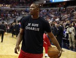 Washington Wizards center Kevin Seraphin, from France, wears a "Je Suis Charlie" T-shirt during warmups for an NBA basketball game against the Chicago Bulls, Friday, Jan. 9, 2015, in Washington.