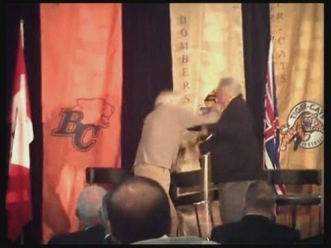 Elderly CFL football players Joe Kapp and Angelo Mosca punch-up