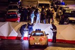 Police investigate a shootout in a street in Verviers, Belgium, Thursday, Jan. 15, 2015.