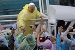 Pope Francis shakes the hands of the faithful after celebrating his final Mass in Manila, Philippines, Sunday, Jan. 18, 2015.