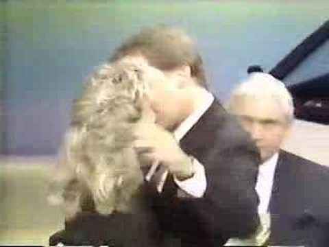 Pat Sajak kisses Vanna White