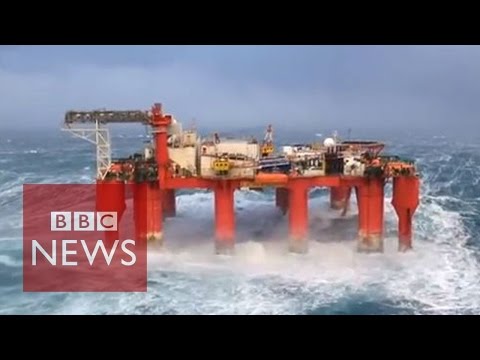 Huge waves crash against swaying North Sea oil rig - BBC News