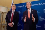 U.S. Secretary of State John Kerry and British Foreign Secretary Philip Hammond address reporters at Lancaster House in London, U.K., before a larger meeting of counter-ISIL coalition partners on January 22, 2015.