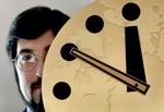  Stephen Schwartz, publisher of the Bulletin of the Atomic Scientists, holds the famous Doomsday Clock, which symbolizes the threat of world nuclear holocaust, Friday, Nov. 2, 2001, at the University of Chicago. After three years of immobility, the board 