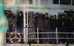 File - The cargo ship Ezadeen, carrying hundreds of migrants, arrives at the southern Italian port of Corigliano, Italy, late Friday, Jan. 2, 2015.