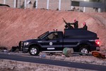 Jordanian security forces leave Swaqa prison, after the executions of Sajida al-Rishawi and Ziad al-Karbouly, two Iraqis linked to al-Qaida, about 50 miles (80 kilometers) south of the Jordan's capital, Amman, Wednesday, Feb. 4, 2015.