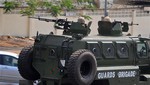 Nigerian soldiers patrol with a armored vehicle in the city of Abuja, Nigeria, Saturday, Feb. 7, 2015.