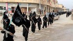 File - This undated image posted on a militant website on Tuesday, Jan. 14, 2014 shows fighters from the al-Qaida linked Islamic State of Iraq and the Levant (ISIL) marching in Raqqa, Syria.