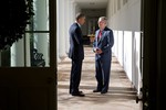 File - While walking with incoming Senate Majority Leader Mitch McConnell from the Oval Office to a lunch with other Congressional leaders, President Obama stopped on the White House Colonnade to discuss the upcoming Congressional session, 7 November, 2014.