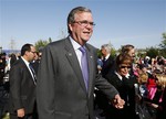 File - Former Florida Gov. Jeb Bush and his wife Columba arrives for the dedication of the George W. Bush presidential library on the campus of Southern Methodist University in Dallas, Thursday, April 25, 2013.