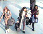 This is a still taken from CCTV issued by the Metropolitan Police in London on Monday Feb. 23, 2015, of 15-year-old Amira Abase, left, Kadiza Sultana,16, centre, and Shamima Begum, 15, going through Gatwick airport