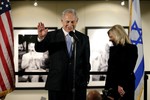 In this Tuesday, March 4, 2014 file photo, Israeli Prime Minister Benjamin Netanyahu, accompanied by his wife Sara, right, speaks before the screening of the television documentary "Israel: The Royal Tour" at Paramount Studios in Los Angeles.