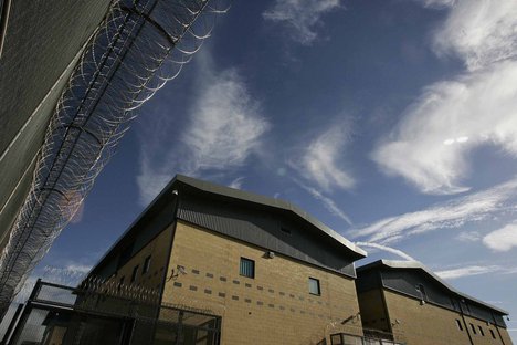 File - The new Colnbrook Immigration Removal Centre is seen near London's Heathrow Airport, Thursday Sept. 16, 2004.