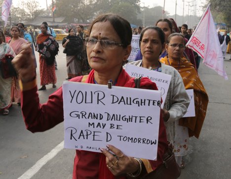 India AISF Womens Supporters hold the Poster to protest against the recent rape case of Sapna Jha at Kolkata on Friday 03 January 2014