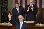 Israeli Prime Minister Benjamin Netanyahu waves as he speaks before a joint meeting of Congress on Capitol Hill in Washington, Tuesday, March 3, 2015.