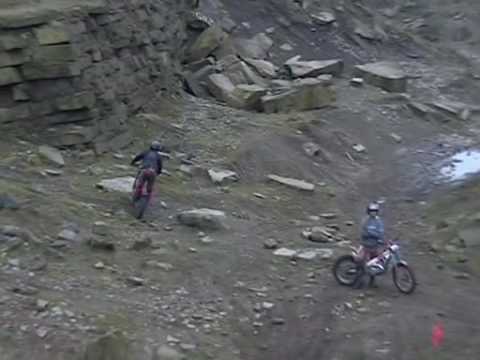 Rob Warner and Steve Peat hitting a big step on there trials bikes