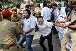 Indian policemen detain activists of Asomiya Yuva Mancha (AYM) during a protest against the lynching of a man accused of rape in front of Nagaland House in Gauhati, in the northeastern Indian state of Assam, Saturday, March 7, 2015. The government of northeastern India's Nagaland state has suspended three officials and deployed paramilitary soldiers after a mob stormed a high-security jail, dragged away the man and then lynched him, officials said Saturday.