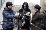 File - Cho Hyun-ah, who was head of cabin service at Korean Air and the oldest child of Korean Air chairman Cho Yang-ho, speaks to the media upon her arrival for questioning at the Aviation and Railway Accident Investigation Board office of Ministry of Land, Infrastructure and Transport in Seoul, South Korea, Friday, Dec. 12, 2014.