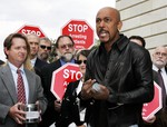 File - Television talk show host Montel Williams, makes his remarks during a news conference with several lawmakers on Capitol Hill to introduce legislation to protect medical marijuana patients from arrest Wednesday, May 4, 2005, in Washington. Standing on the left is Irvin Rosenfeld of Fort Lauderdale, Fla., holding a can of his federally prescribe marijuana.