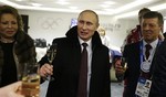 Russian President Vladimir Putin toasts guests in the presidential lounge following the opening ceremony of the 2014 Winter Olympics