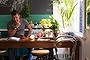 The ground-floor Sydney apartment of Alex Zabotto-Bentley (pictured at the kitchen table) of AZBcreative.
SHD SUNDAY LIFE Picture by JENNIFER SOO SLIFE121118